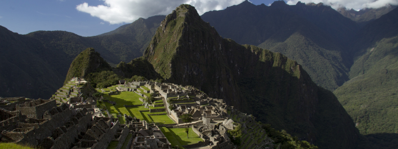 Tourists showing tickets and passports at Machu Picchu entrance